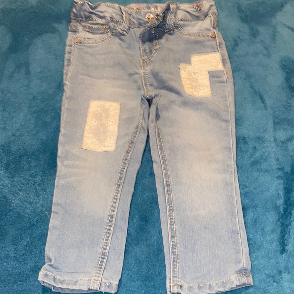 LEE Jeans, adorned w/white patches.